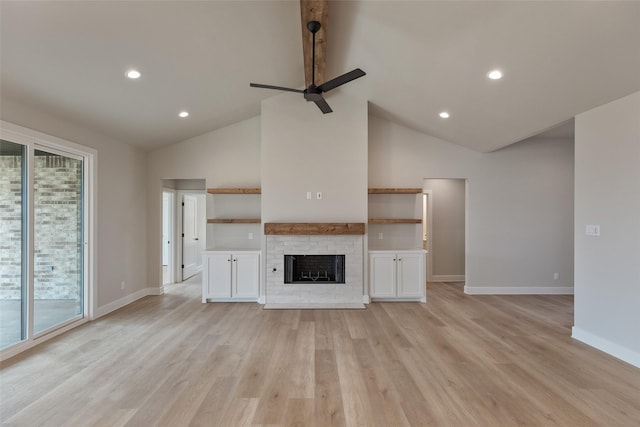 unfurnished living room with light wood-type flooring, high vaulted ceiling, and ceiling fan