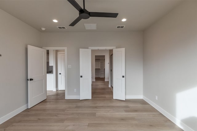 unfurnished bedroom with light hardwood / wood-style floors and ceiling fan