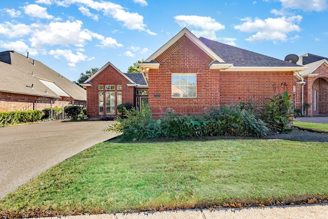 view of property with a front lawn