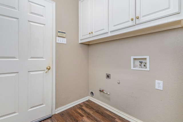 washroom with electric dryer hookup, dark hardwood / wood-style flooring, hookup for a washing machine, cabinets, and gas dryer hookup