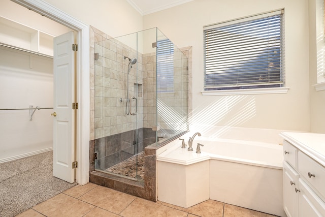 bathroom with independent shower and bath, ornamental molding, tile patterned floors, and vanity