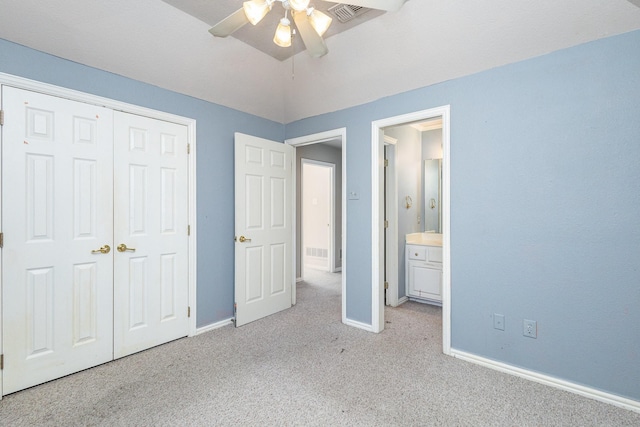 unfurnished bedroom with light carpet, ceiling fan, and a closet