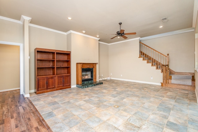 unfurnished living room featuring ceiling fan and crown molding