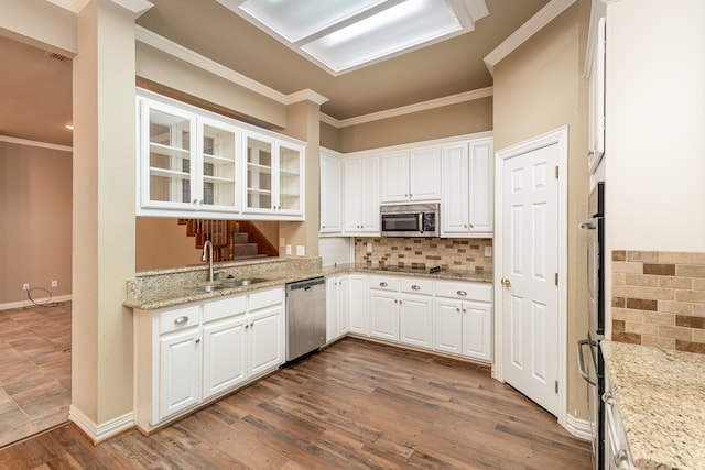 kitchen featuring light stone countertops, white cabinets, dark hardwood / wood-style flooring, stainless steel appliances, and sink