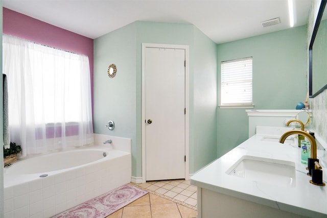 bathroom with vanity, tiled bath, and tile patterned floors