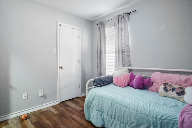 bedroom featuring dark wood-type flooring