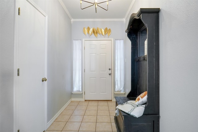 entrance foyer featuring crown molding and light tile patterned flooring