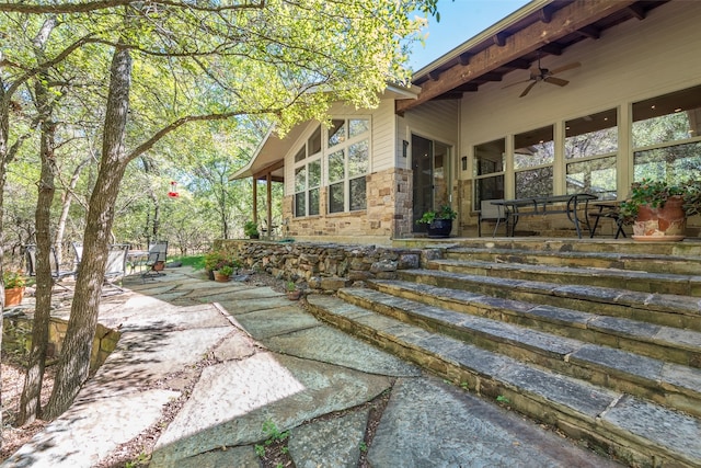 view of home's exterior with a patio and ceiling fan