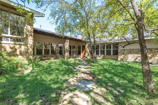 view of yard featuring a sunroom