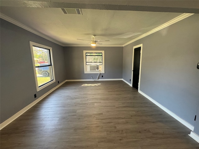 empty room featuring ornamental molding, ceiling fan, and dark wood-type flooring