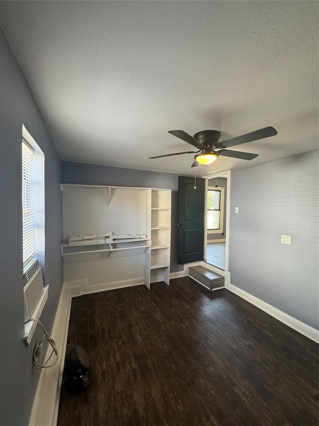 interior space with a textured ceiling, hardwood / wood-style flooring, and ceiling fan