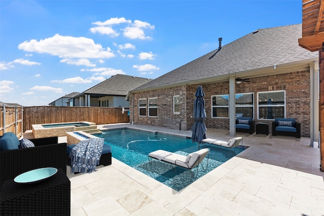 view of pool with outdoor lounge area, an in ground hot tub, ceiling fan, and a patio