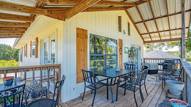 wooden terrace with a grill