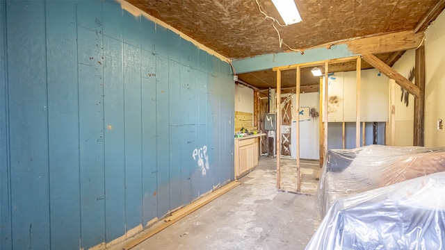 interior space featuring wood walls