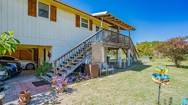 view of side of property with a lawn and a carport