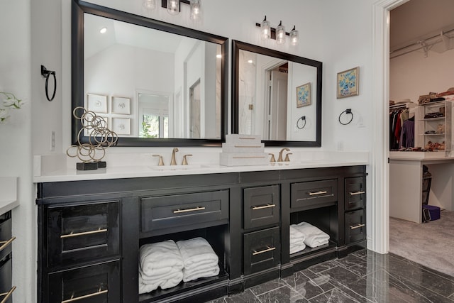 6709 Elderberry Way, Flower Mound, TX 76226 - bathroom featuring double vanity, a walk in closet, and marble finish flooring