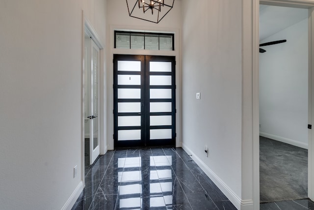 6709 Elderberry Way, Flower Mound, TX 76226 - entrance foyer with french doors and a chandelier