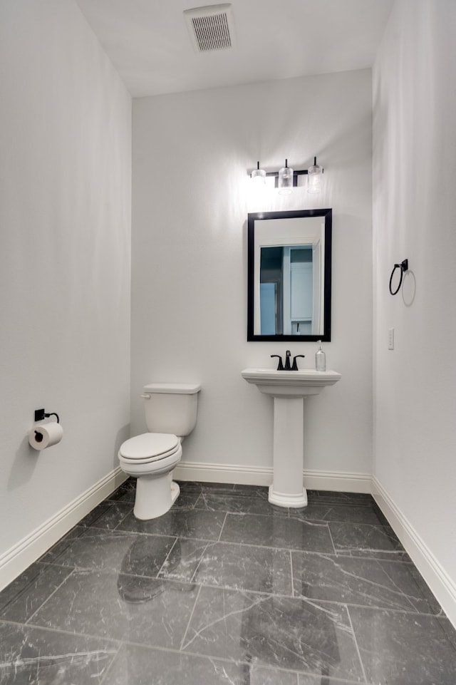 6709 Elderberry Way, Flower Mound, TX 76226 - bathroom featuring baseboards and marble finish flooring