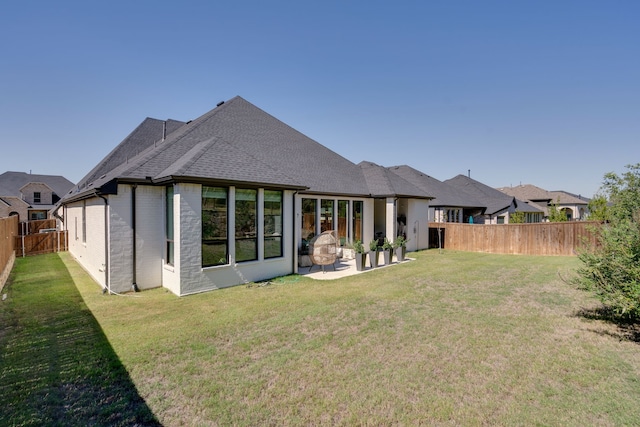 6709 Elderberry Way, Flower Mound, TX 76226 - rear view of property featuring a fenced backyard, a patio, brick siding, and roof with shingles