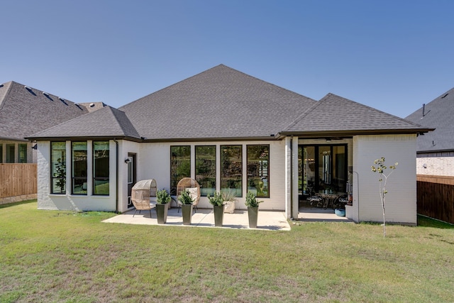 6709 Elderberry Way, Flower Mound, TX 76226 - rear view of house featuring a fenced backyard, a patio area, a shingled roof, and brick siding