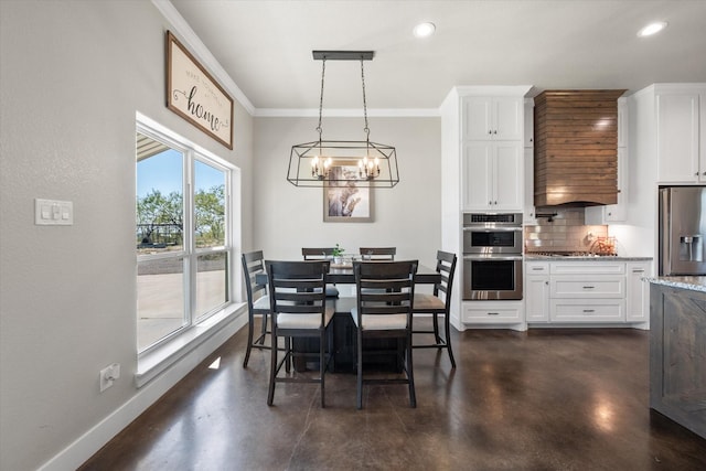 dining area with an inviting chandelier and ornamental molding