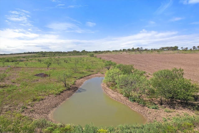 view of property's community featuring a rural view and a water view