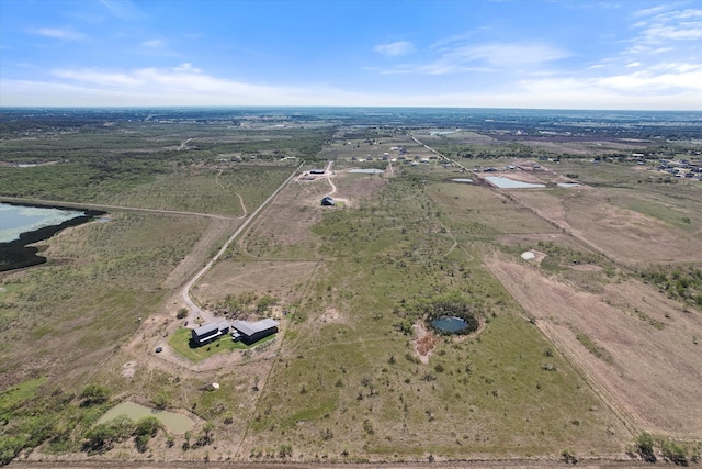 birds eye view of property featuring a rural view