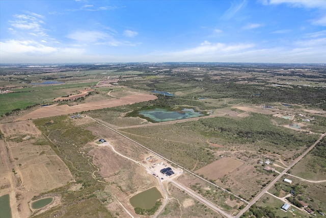 aerial view with a rural view and a water view