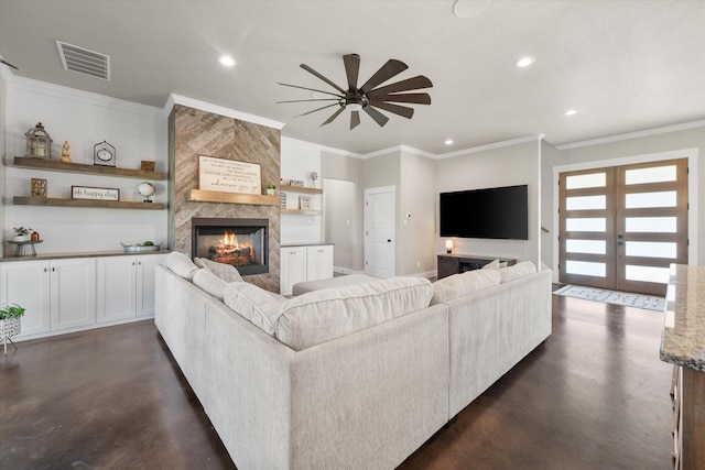 living room with ceiling fan, crown molding, french doors, and a fireplace