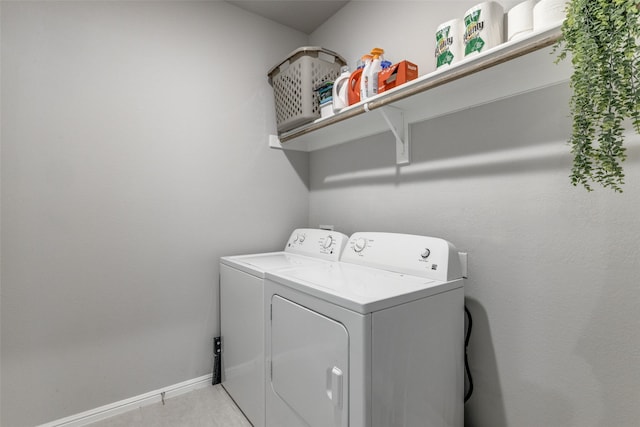 clothes washing area featuring separate washer and dryer