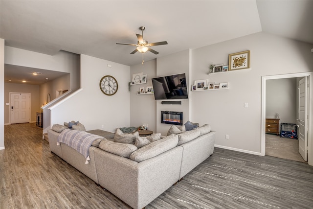 living room with vaulted ceiling, ceiling fan, and dark hardwood / wood-style floors