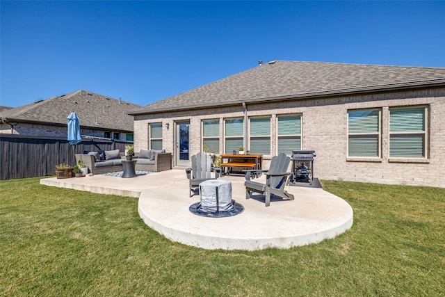 rear view of property featuring a patio area, a yard, and outdoor lounge area