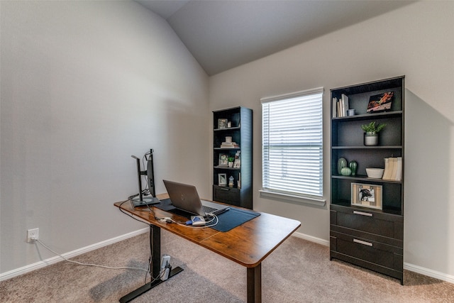 office area with lofted ceiling and carpet