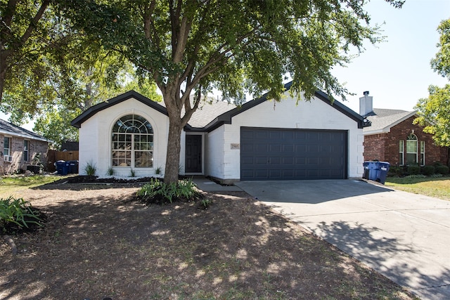 ranch-style house featuring a garage