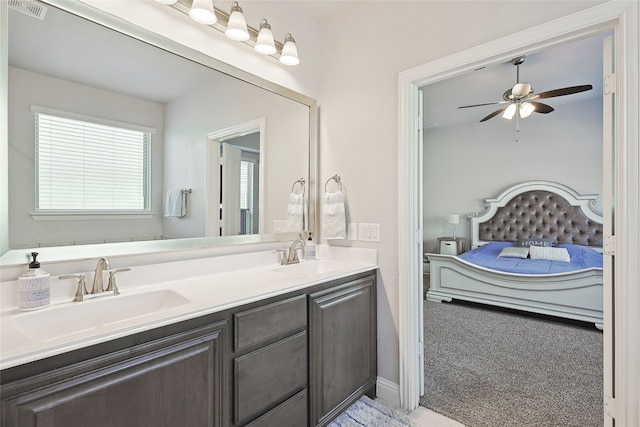 bathroom featuring ceiling fan and vanity