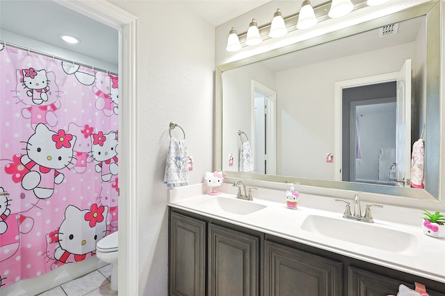 full bathroom featuring shower / tub combo, tile patterned flooring, vanity, and toilet