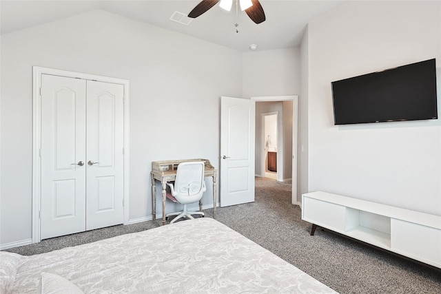 carpeted bedroom with lofted ceiling, a closet, baseboards, visible vents, and ceiling fan
