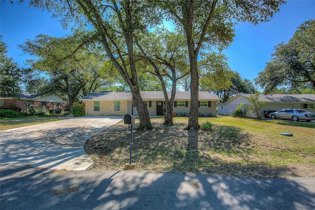 ranch-style house with a front yard