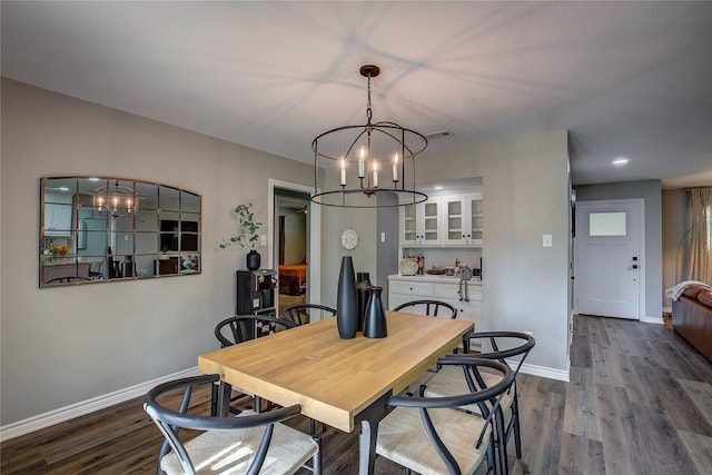 dining room with a chandelier and hardwood / wood-style flooring