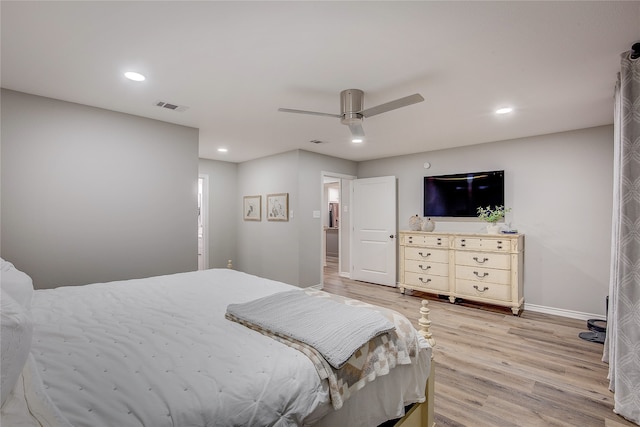 bedroom with ceiling fan and light hardwood / wood-style floors