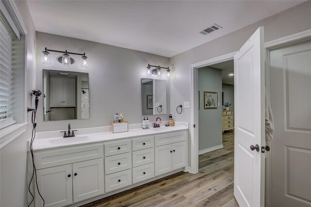 bathroom featuring wood-type flooring, shower / tub combo, and toilet