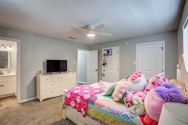 carpeted bedroom with ceiling fan and connected bathroom