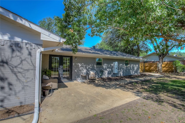 back of property featuring french doors and a patio