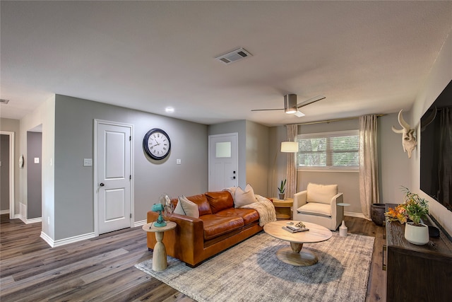 living room with ceiling fan and wood-type flooring