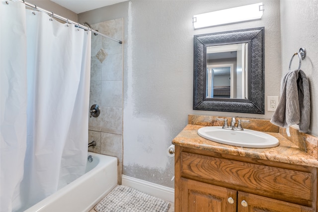 bathroom with shower / tub combo with curtain, tile patterned flooring, and vanity