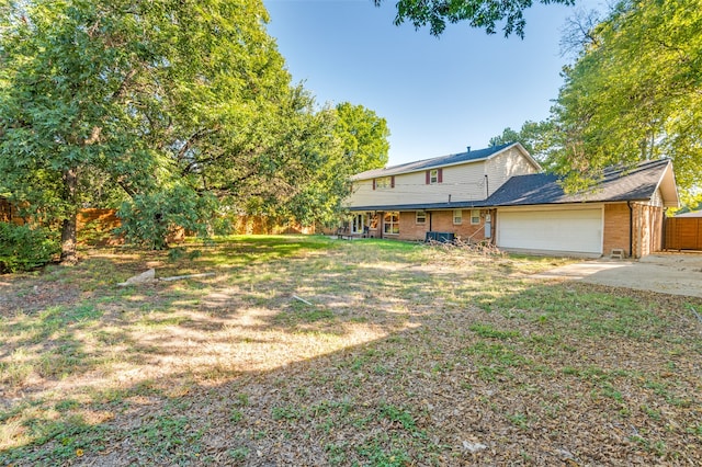 view of front facade with a front yard and a garage