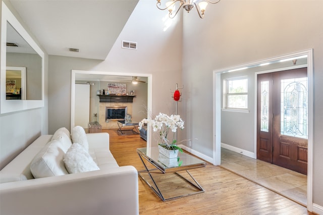 living room featuring an inviting chandelier and hardwood / wood-style flooring