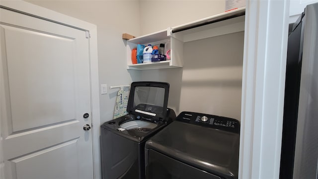 laundry area with washing machine and clothes dryer