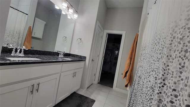 bathroom with tile patterned flooring, vanity, and a shower with shower curtain