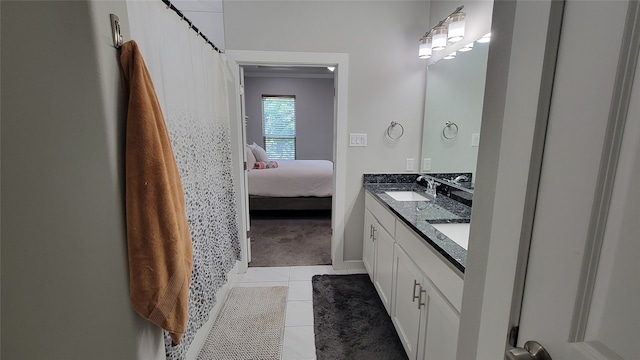 bathroom with vanity and tile patterned flooring